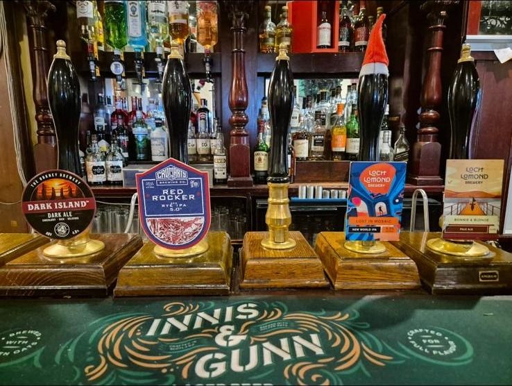 Real ale hand pumps at the bar of The Castle Tavern, Inverness